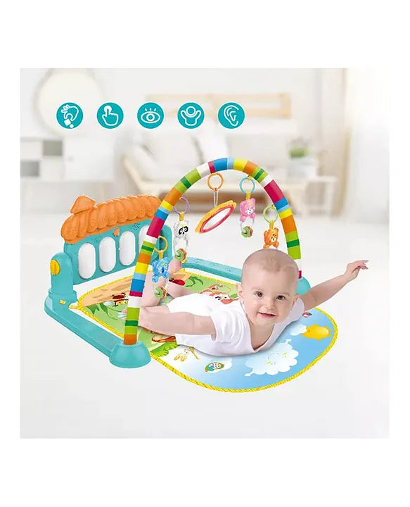 Baby enjoying tummy time on the piano gym play mat with colorful hanging toys and soft rainbow arch