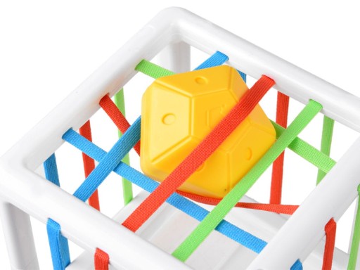 Baby Shape Activity Cube Designed for Early Sorting and Tactile Learning with yellow shape held by elastic bands