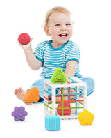 Baby Shape Sorting Cube Featuring Soft Shapes and Easy Push shown with baby holding and playing with shapes