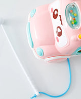 Pink musical learning bus with cute face, pull string, rattle dome and white baton for early play
