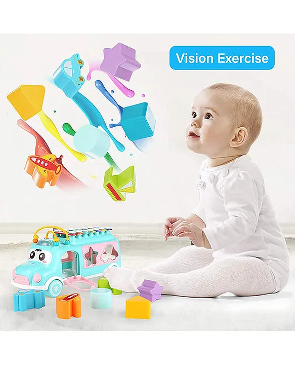Baby playing with Musical Shape Sorting Bus with colorful blocks for matching and visual learning