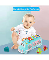 Baby playing with Musical Shape Sorting Bus with xylophone top and colorful matching blocks