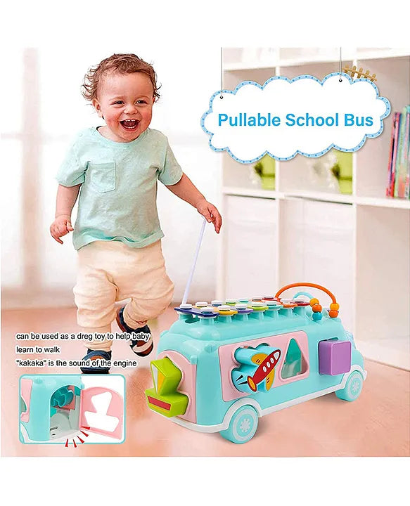 Toddler pulling the Musical Shape Sorting Bus with matching blocks and xylophone music play features