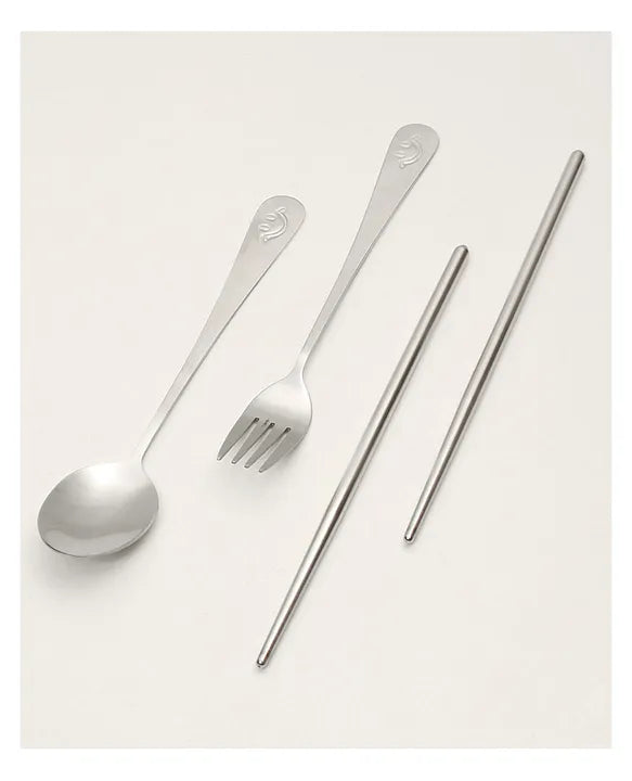 Stainless steel spoon, fork and chopsticks set included with the three-compartment lunch box.